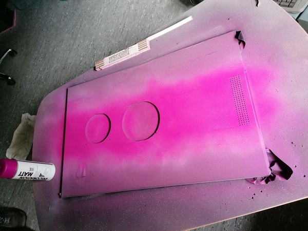 Then I painted the middle part pink_ After the tape was removed I noticed the paint came off in one spot_ Well, that's how it goes if you don't do it right_ I can just cover this with a sticker_ For now I just added a matte clearcoat_