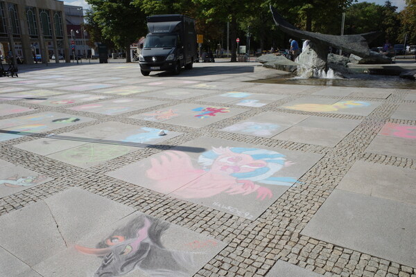 Alright, the chalk ponies have almost made it to the other side of the square. (Not really, the square stretches around and is huge.)