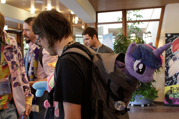 Large plushies can poke out of backpacks as well_